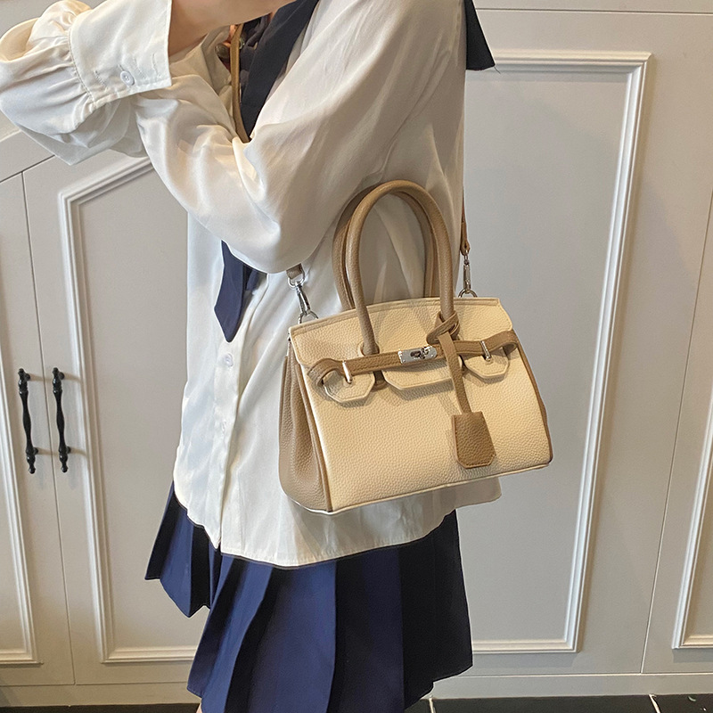 Bolso portátil de platino con textura de moda transfronteriza, bolso de hombro simple y versátil de lujo ligero, bolso de nicho de temperamento de gran capacidad