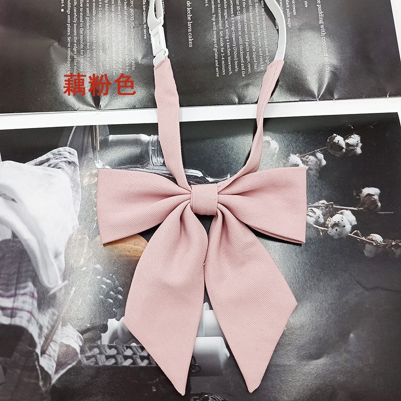 Spot al por mayor versión estrecha niña pequeña pajarita de raíz de plumas pajarita flor moda nuevo lazo color sólido jk pajarita satinado