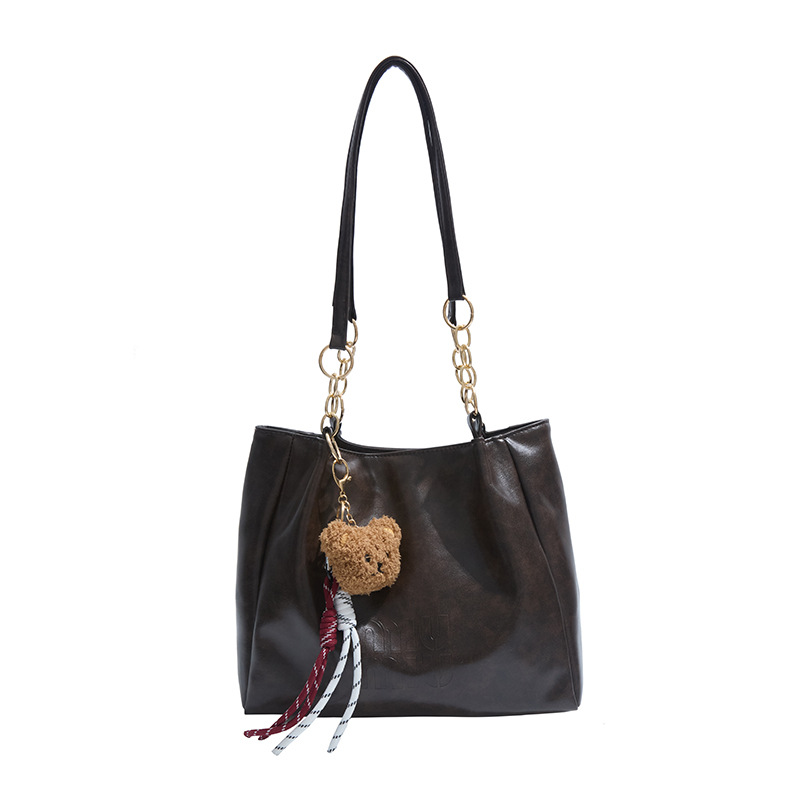 Bolsa de moda retro para estudiantes universitarios, bolsas de brazo para viajar en la primavera 2025, bolsas de ocio de nicho para mujeres.