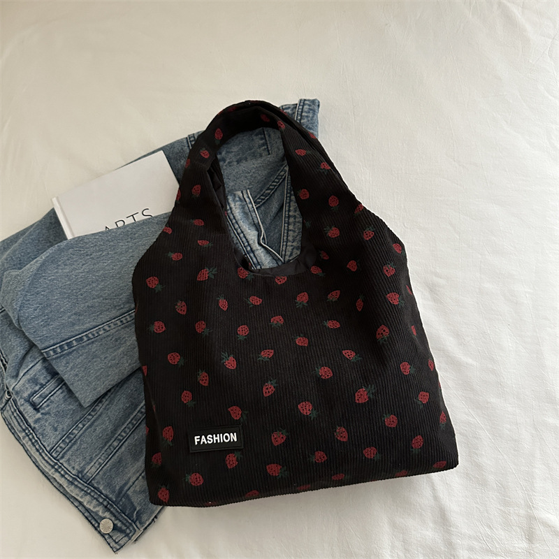 Bolso de meandruño 2024 nuevo hombro de gran capacidad bolso de mano de transporte literario versátil impresión brazaleta