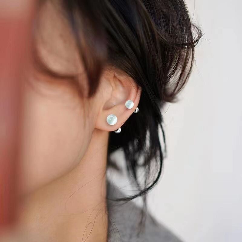 女性用キャッツアイストーンイヤリング、ニッチデザイン、スレッドツイストバックル、就寝時に外す必要なし、高級耳ピアス、スパイラルイヤリング|undefined