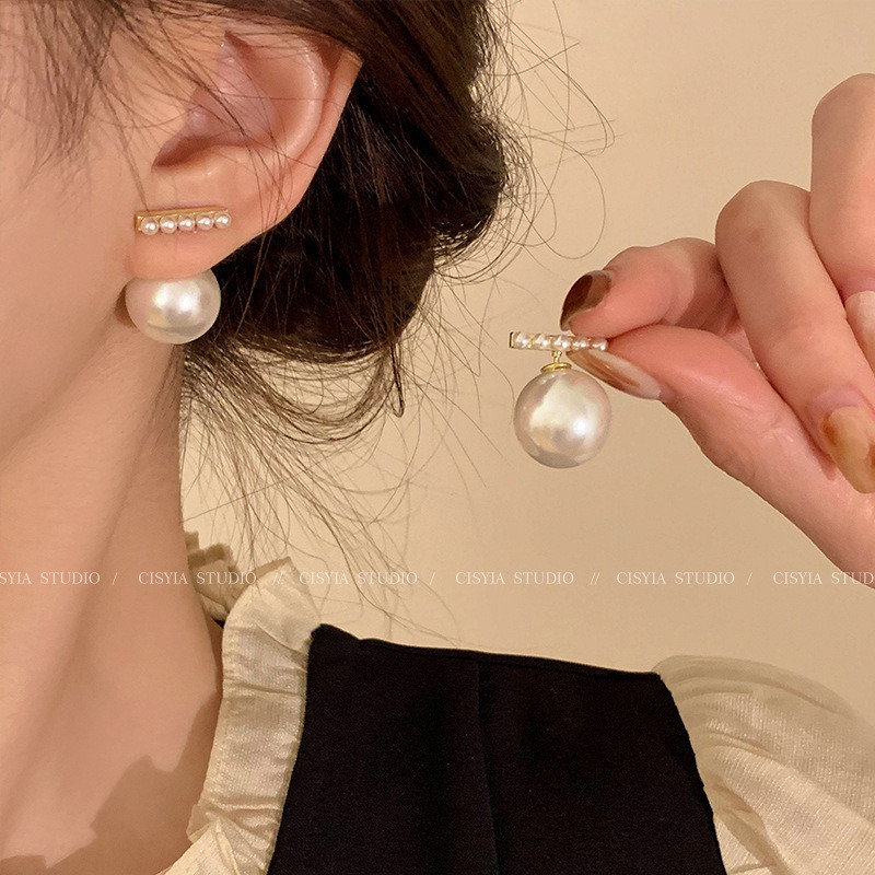 Luz de lujo de alto nivel nicho de diseño femenino sensación de aretes de bordilla temperamento perla asimetría joyería perla al por mayor