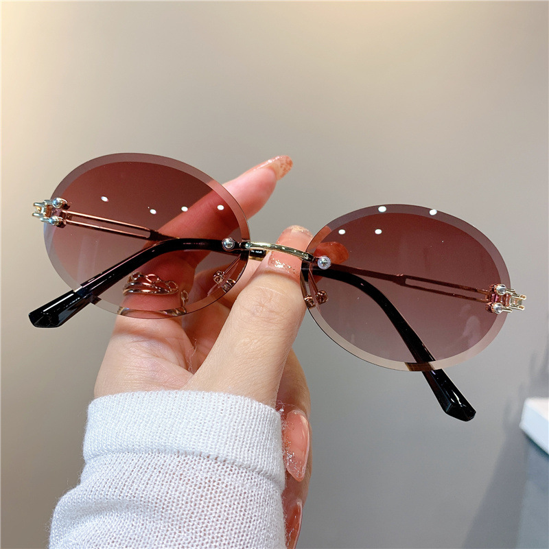 New Sunglasses Women's Oval Gradient Sunglasses Frameless Cutting Edge Trendy Glasses_voghion.com