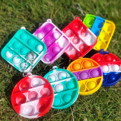 Amazon explosión mini 50 * 50 burbujas de silicona para niños juguetes de reducción de presión pionero colgante de llaver