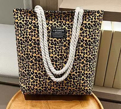 Bolso de mujer 2026 nueva impresión bolso de lona de moda leopardo coreano bolso de gran capacidad bolso de hombro de mano de compras