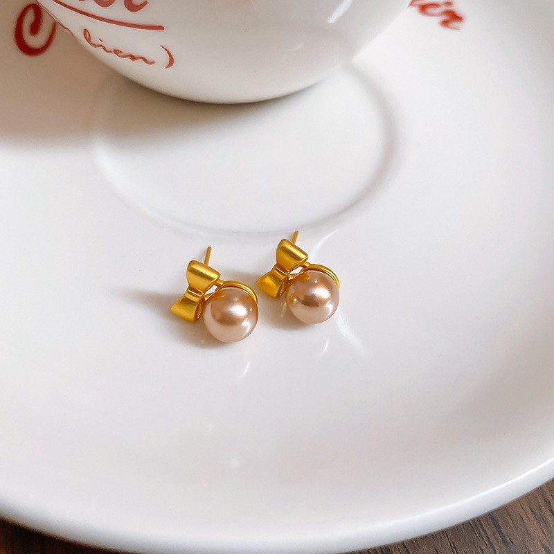 Aguja de plata Pendientes de lazo de diamantes coreanos Pendientes de temperamento de moda de todo fósforo Pendientes de diseño de nicho Sentido de lujo ligero