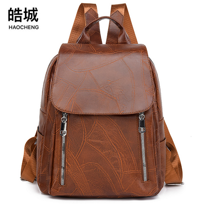 Comercio exterior al por mayor 2023 nueva versión coreana de las señoras de cuero suave mochila de viaje al aire libre retro de moda mochila escolar de moda