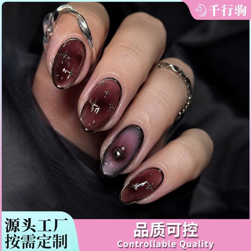 Customized 30-piece wearable nail art set in burgundy almond shape with starburst and heart designs, sweet and cool wearable nail patches