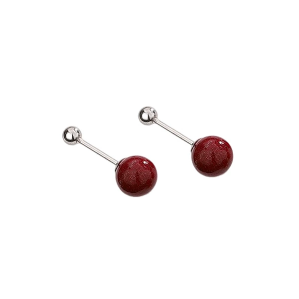 A pair of cinnabar screw earrings