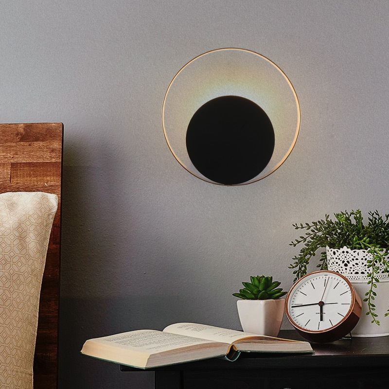 Lámpara de pared de cabecera moderna nórdica del dormitorio creativo y individual simple sala de estar pasillo estudio eclipse lujoso luz de fondo lámpara de pared