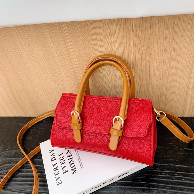 2025 nuevo bolso para niños de comercio exterior, bolso de niña popular de moda coreana, bolso de mensajero para bebé de color sólido de estilo extranjero