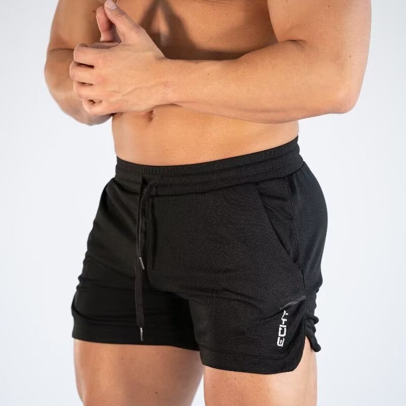 Summer men's athletic shorts, casual and versatile, with a drawstring waistband, side lettering, and side slits, suitable for fitness training and running