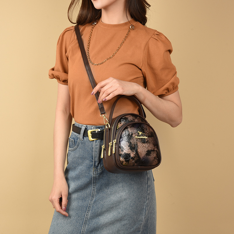 Bolsa de moda transfronteriza de madres de mediana edad, bolso de hombro de impresión de cuero blando, 2024 nuevo estilo chino de damas, bolso de mochila