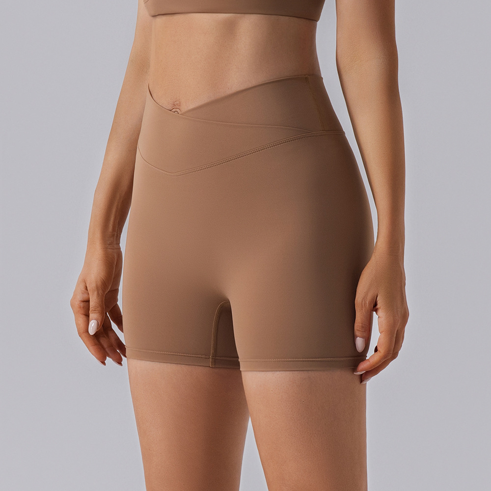 Procesamiento personalizado europeo y americano elástico mel桃 hips fitness pantalones cortos desnudos secado rápido sexy para elevar las hips de yoga de mujer panty