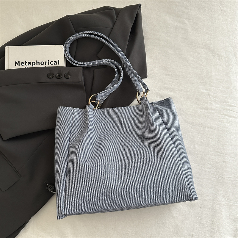 Bolsa de textura para mujeres de gran capacidad 2025 nueva primavera y verano ocio rayas bolsas de compras de hombro para clase de viaje bolsa