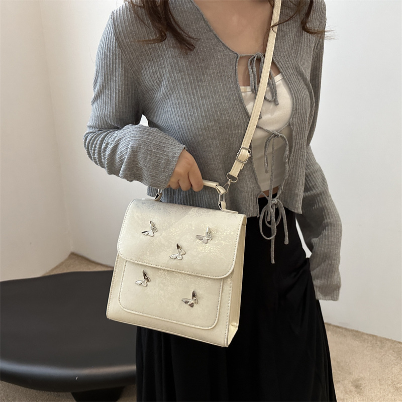 Mochila de mujer casual de estilo exterior versátil 2024 verano nuevo viaje de alta calidad mariposa mini mochila