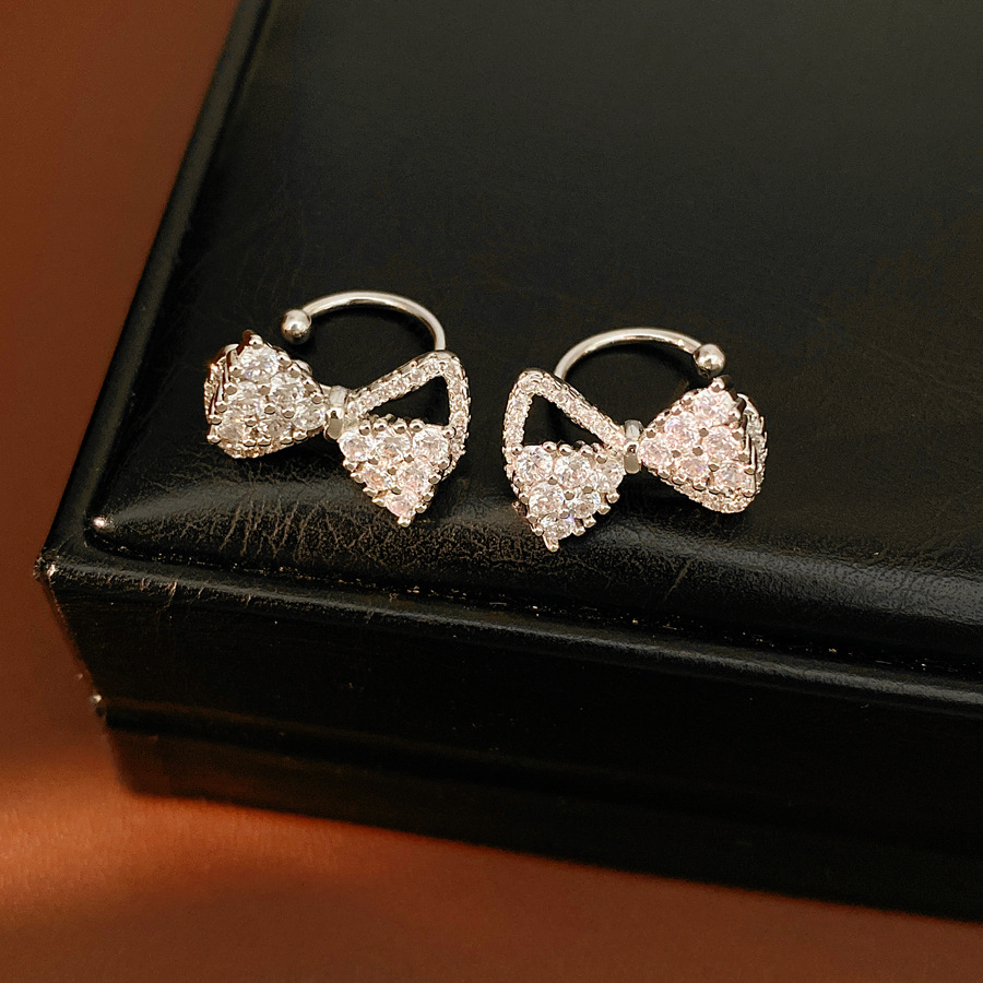 Zircon arco flores orejas clips de orejas mujeres sin agujeros de orejas personalidad temperamento nicho pendientes ligero lujo alta sensación auriculares al por mayor