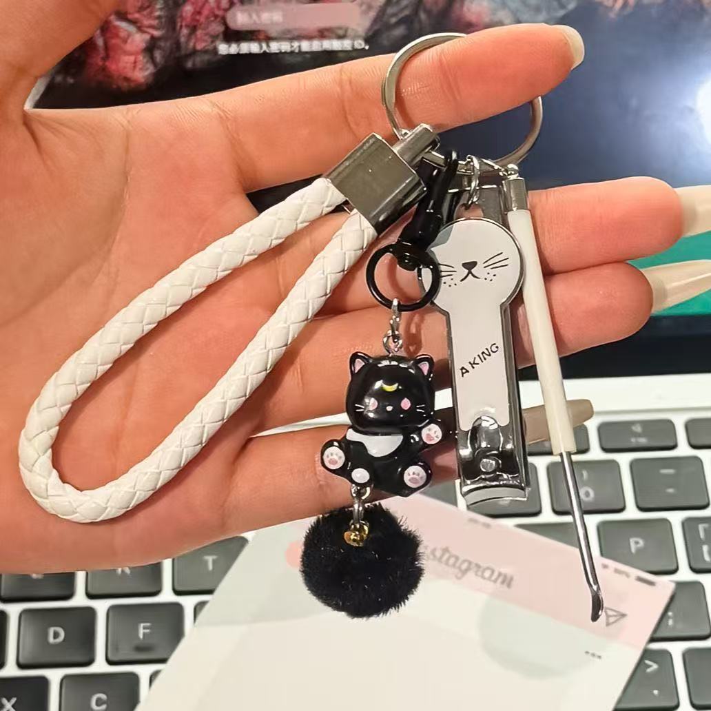 White leather rope + black cat hair ball pendant + white cat face nail scissors …