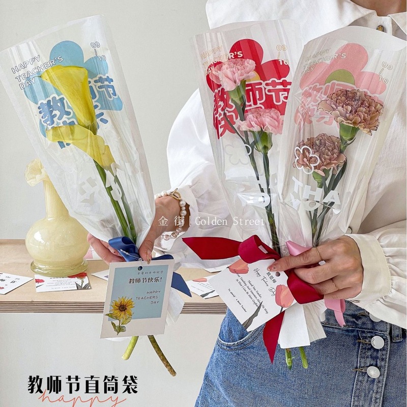 教師の日のまっすぐな筒の単本袋のクラフト紙の一体袋のカーネーションのバラの花束の包装袋の生花の包装材料|undefined