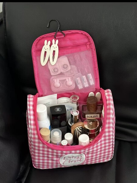 Capacious handheld cosmetic bag to go out