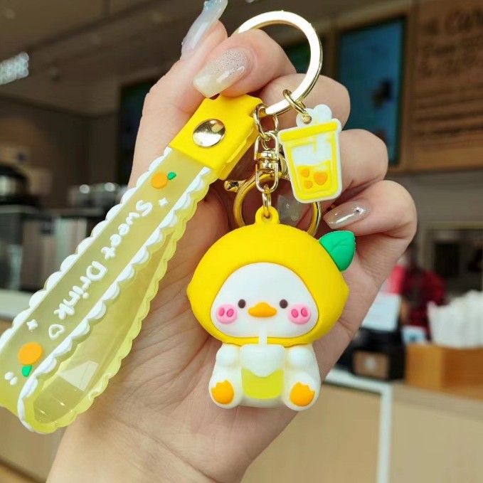 Muñeca de dibujos animados goteo llavero bolsas escolares exquisitas para hombres y mujeres colgantes para agarrar muñecas colgantes para el mercado nocturno regalos al por mayor