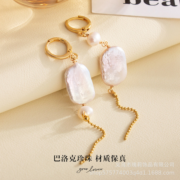 Organic earrings from pearl with bow heart shaped with tassels