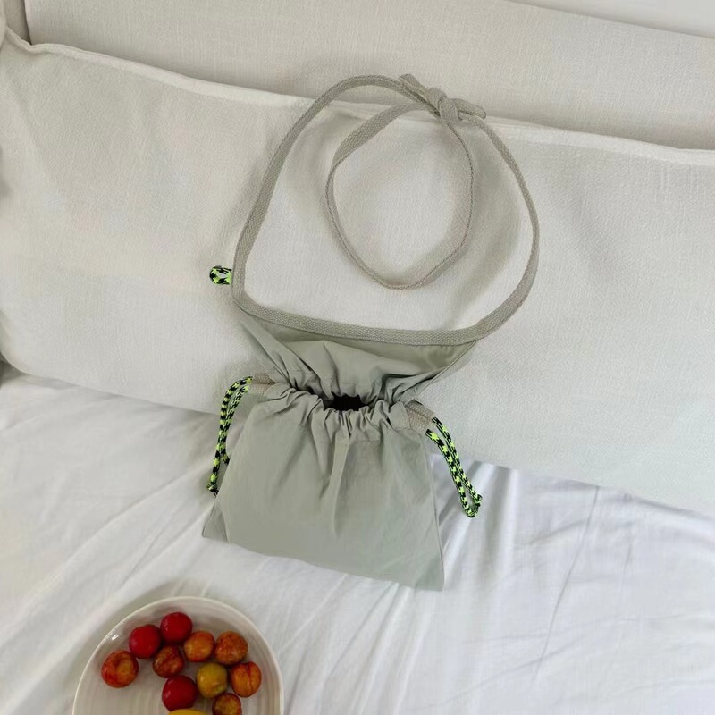 Thailand Niche Designer Brand Drawstring Crossbody Small Bag Cute Simple Lightweight Mobile Phone Bag Shopping Lightweight Small Bag