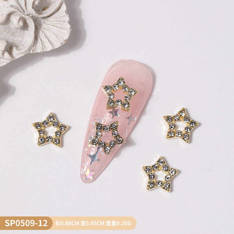 Venta caliente transfronteriza mariposa joyería de uñas aleación hueca alas de diamantes estrella de cinco puntas accesorios de decoración de uñas al por mayor