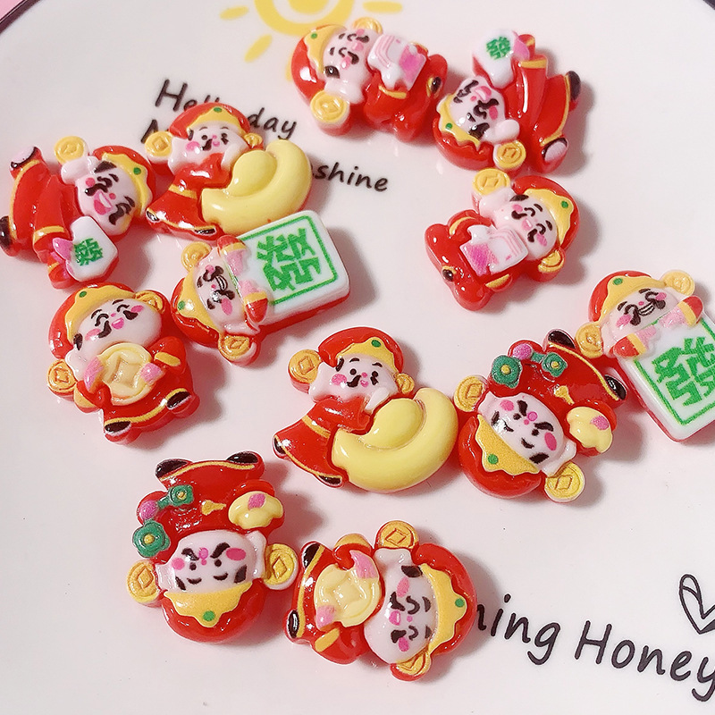 Año Nuevo dibujos animados dios de la fortuna Yuanbao accesorios de resina agujero zapatos caja de teléfono celular crema pegamento DIY automóvil control central dios de la fortuna