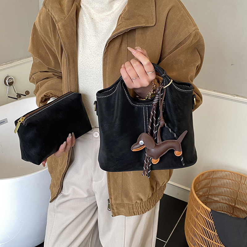 Transfronterizos viajeros bolsas de mano retro mate bolsas de balde de mano mujeres otoño e invierno 2025 nuevo mochila de hombro