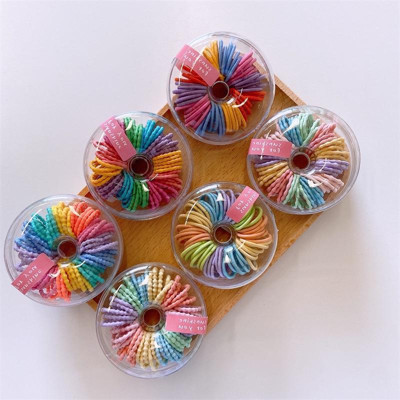 Nuevo color fluorescente de los niños anillo de pelo pulgar 60 caja redonda banda de goma nuevo anillo pequeño no duele traje de pelo