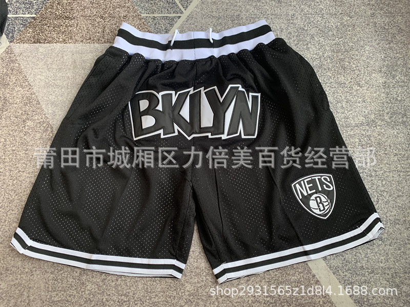 Comercio exterior pantalones de fútbol al por mayor Warriors Lakers 76 caliente Raptor mágico bolsillo bordado pantalones cortos pantalones de baloncesto NFL