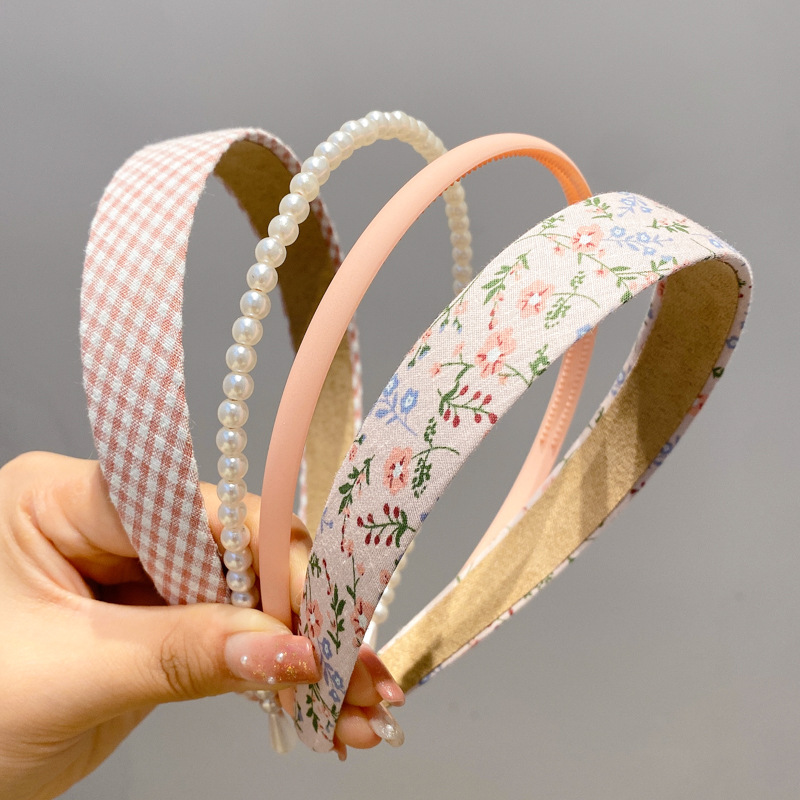 A principios de la primavera, la banda de cabello para mujeres en línea, 2025 nuevo lavado de cara de presión de tarjeta de cabello para el cabello, banda de cabello de perlas, banda de cabello para mujeres.