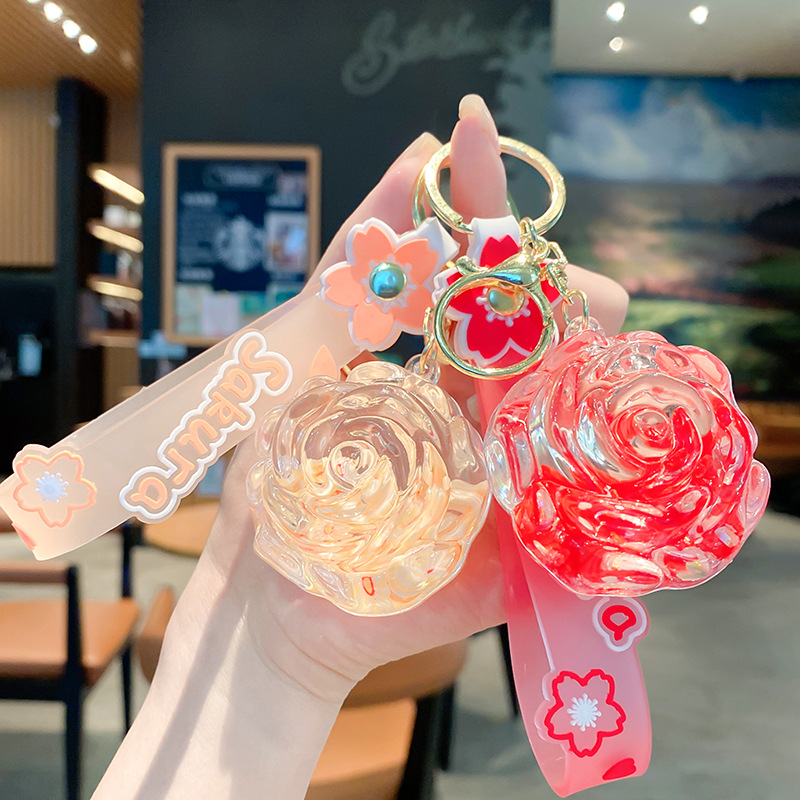 Llavero de rosa de aceite creativo lindo líquido arenas movedizas colgantes pequeños bolsos accesorios pareja pequeños regalos al por mayor