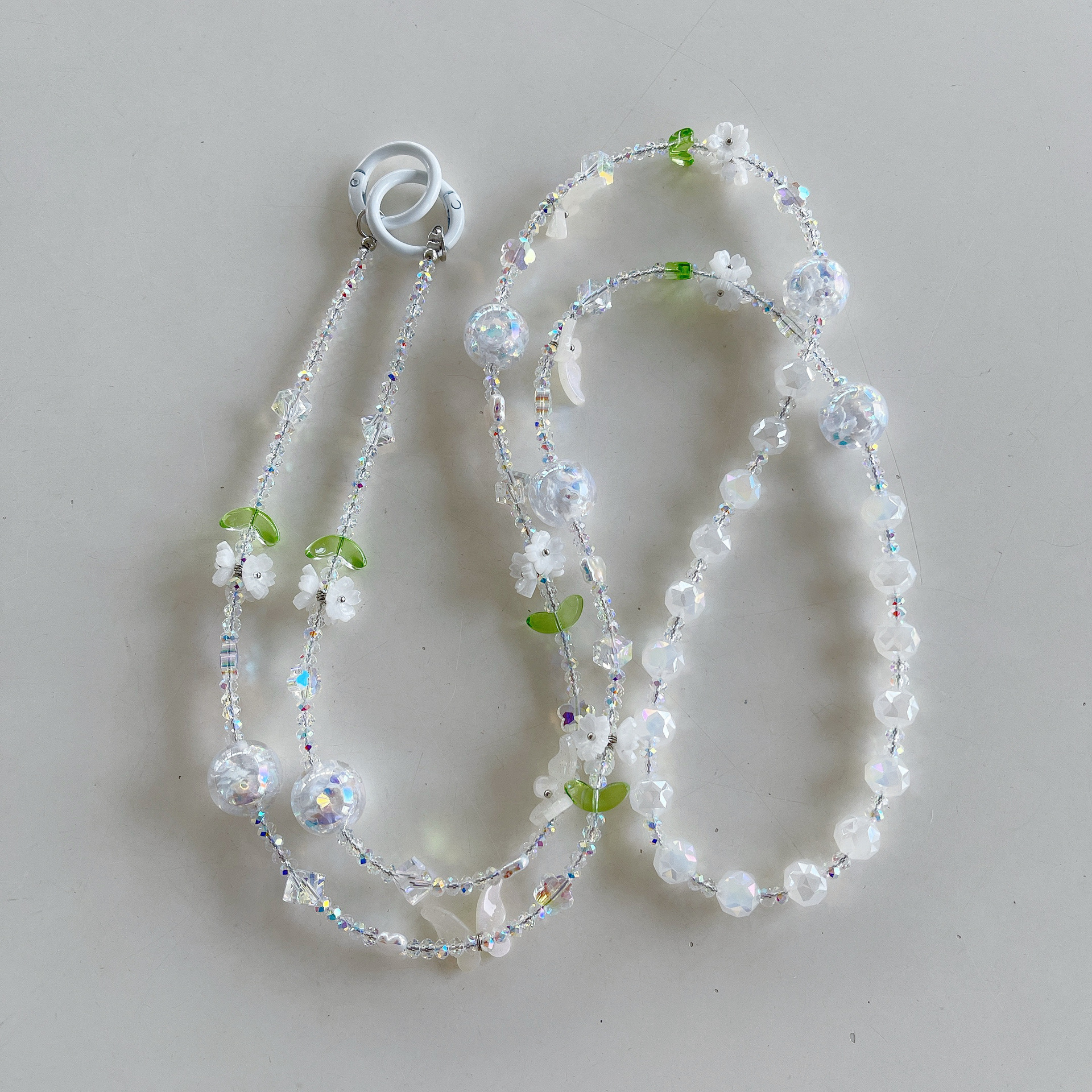 Boutique hecho a mano de alta gama para teléfono móvil cadena larga de cristal ins fresco cordón de teléfono móvil de moda colgante de mensajero largo