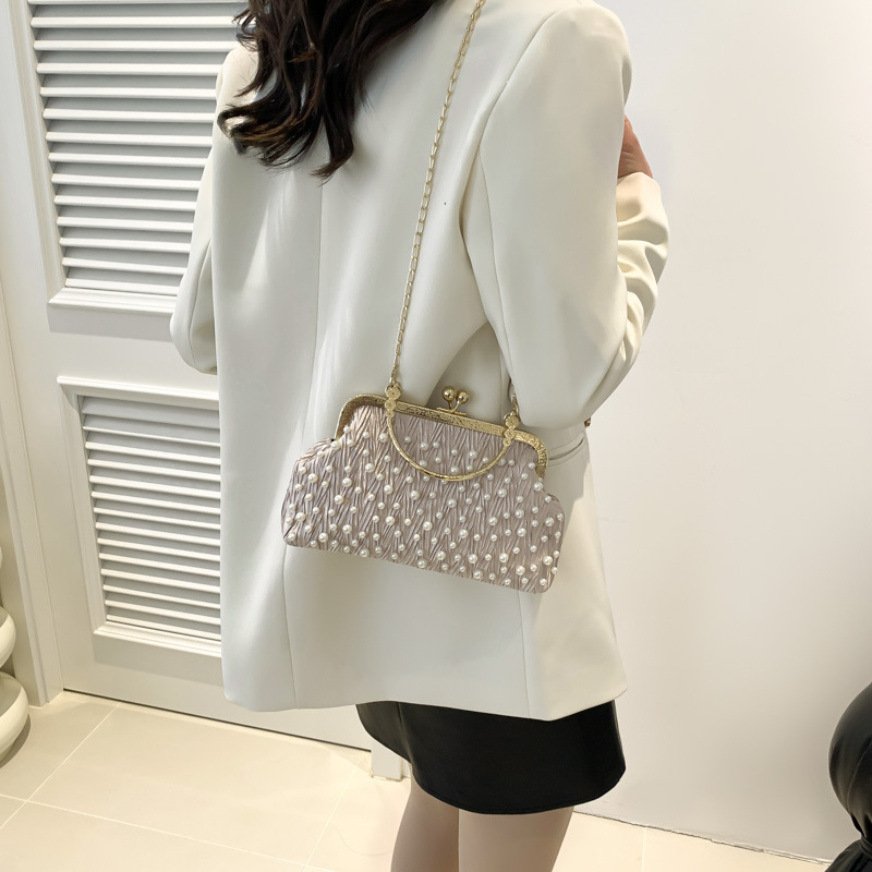 Bolso de las mujeres bolso de la cadena de la perla 2024 principios de primavera nueva moda bolso de hombro fresco dulce hermoso bolso crossbody de aspecto alto para las mujeres