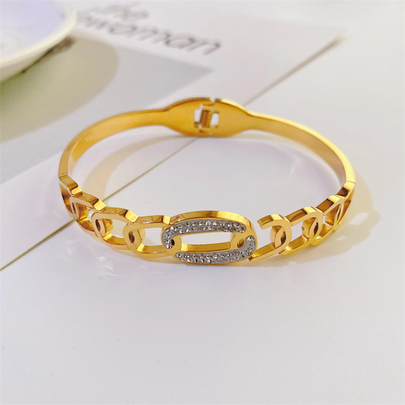 Fashionable New Plated 18k Gold Hollow Inlaid Zircon Titanium Steel Bracelet display picture 2