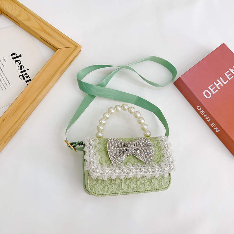 Bolsa de Niños de estilo coreano lindo arco perla Bolso pequeño princesa estilo occidental desgaste a juego joyería bolsa crossbody bolsa