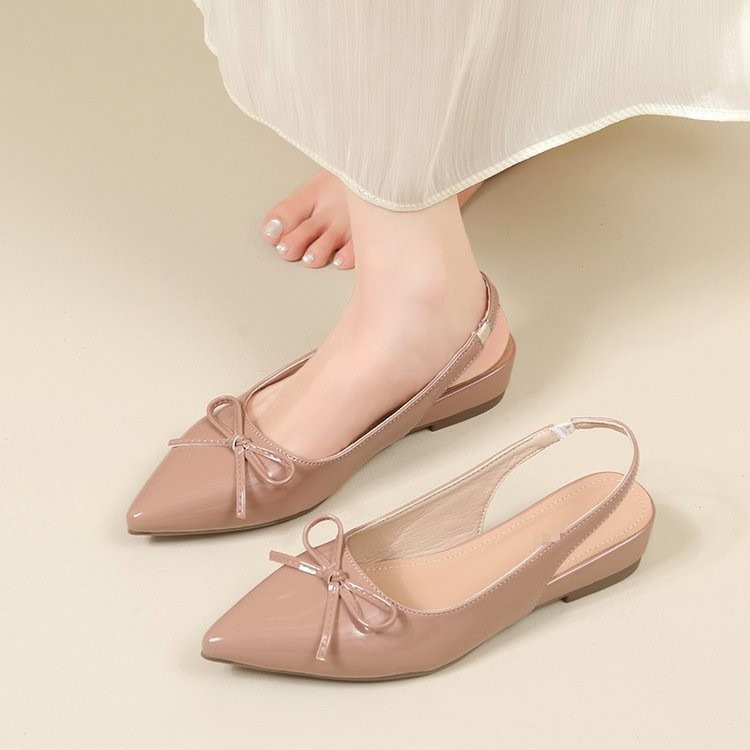 Zapatos de tacones planos transpirables para mujeres verano 2026 nuevo arco de estilo francés detrás de zapatos vacíos sandalias de punta para mujeres