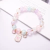 Feeding bottle, beaded bracelet