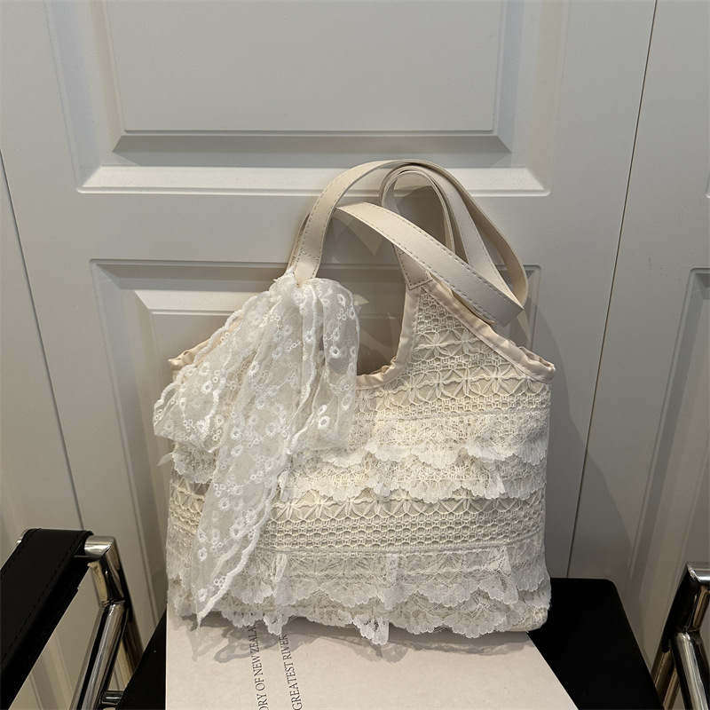 Bolsos de gran capacidad para mujer 2025 nuevo bolso de hombro tejido hueco de encaje de verano para estudiantes universitarios