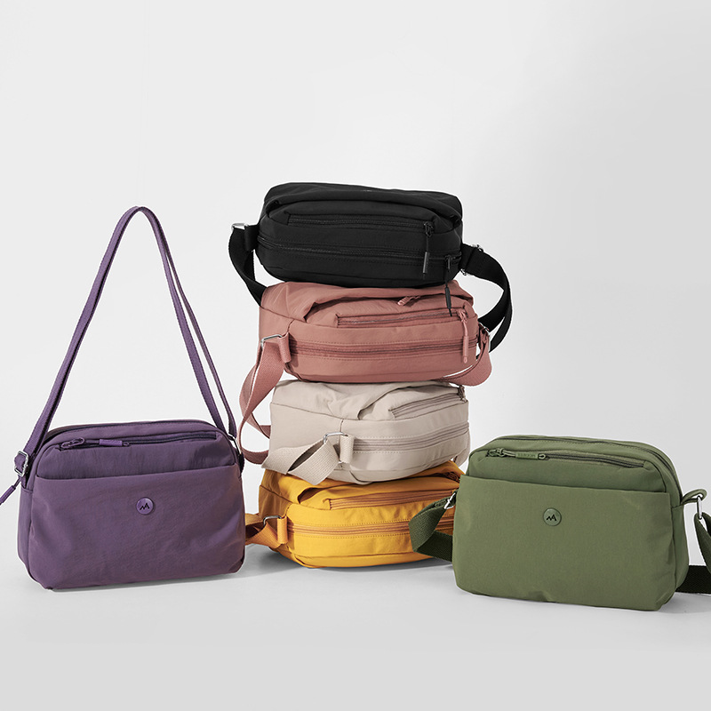 2026 primavera nueva simple bolso de tela de nylon versátil bolso de mochila de comercio exterior transfronterizo bolso de hombro de mujer ligero multicapa