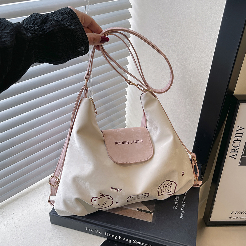 Bolso de mujer de tres usos 2025 nuevo encantador nicho de estilo extranjero mochila de hombro casual textura simple mochila de empalme