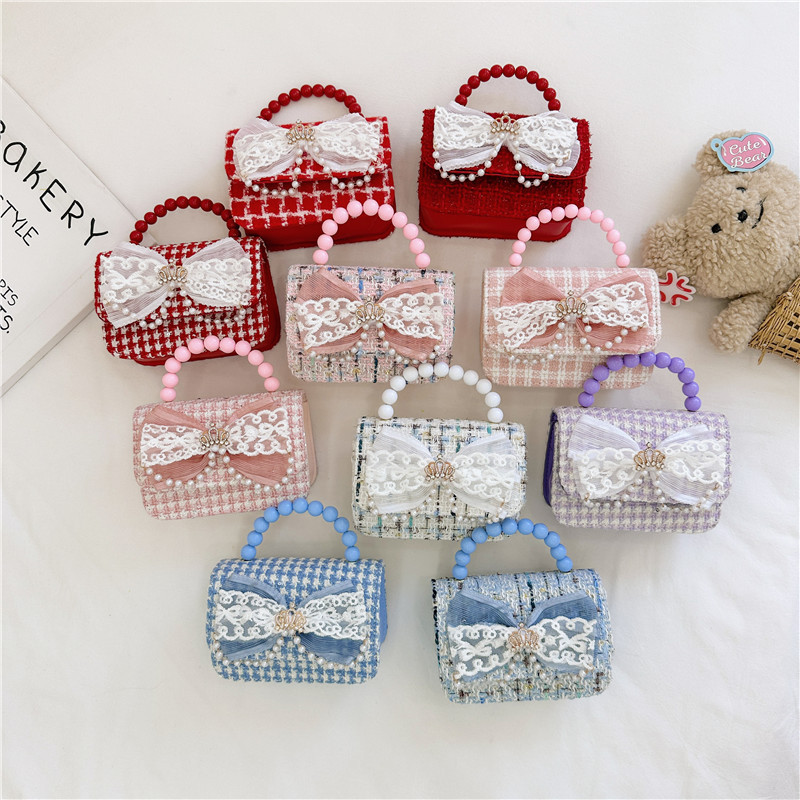 2024 nueva moda lindas bolsas de hombro para niños bolsas de perlas a cuadrícula bolsas extranjeras bolsas de hombro para niñas gran capacidad marea