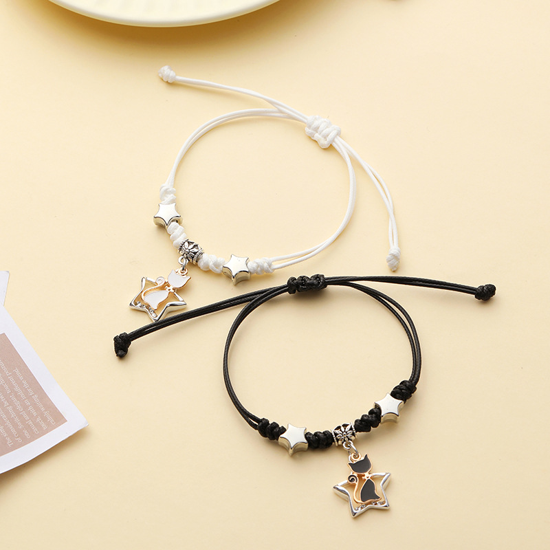 Pulsera pareja corazón hueco trenzada ajustable blanco negro_voghion.com