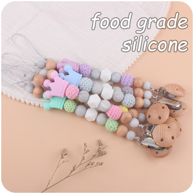 Suministros para bebés calmante clip de chupete de haya bebé anti-caída de la cadena de dibujos animados corona de silicona perlas mordedura molar chupete cadena