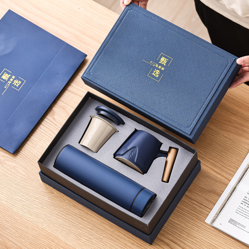 Guofeng Wenchuang marca taza de cerámica Zhoushan tres piezas juego de regalo de mano taza de calentamiento tallado comercial LOGO nombre