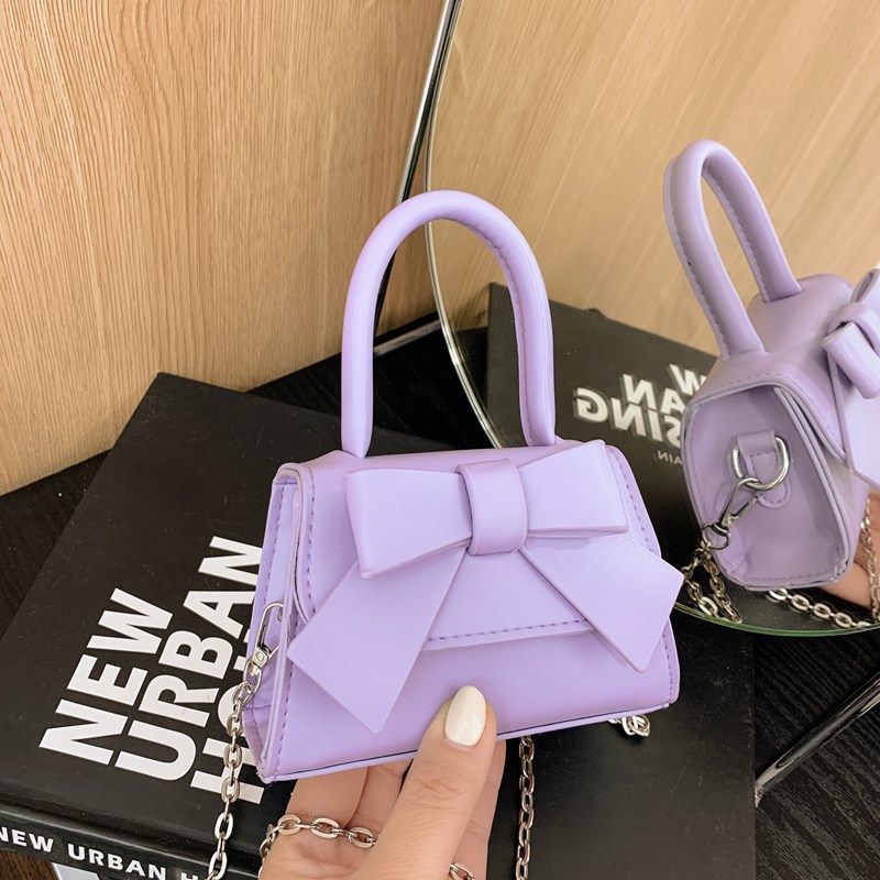 Bolso de mujer 2025 tendencia de primavera nuevo arco de moda para niños bolso de hombro de estilo extranjero bolso de mano
