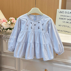 女の子の長袖綿質の青い刺繍の小さい花のシャツの女性の宝のシャツの2025春の新型の韓国版の甘いフランス