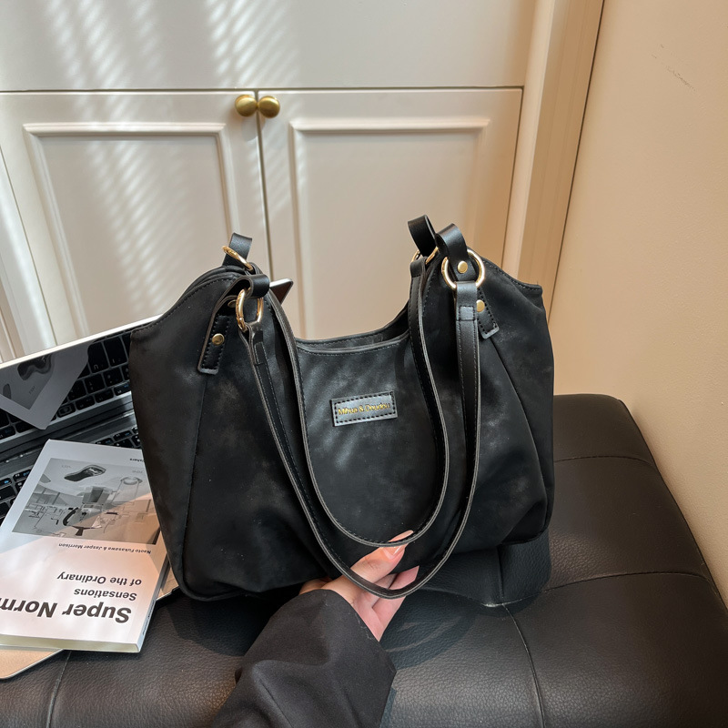 Bolsa de mano de peluche retro de gamuza para mujeres 2025 nueva moda versátil bolso de viaje tote bolso de hombro casual braza